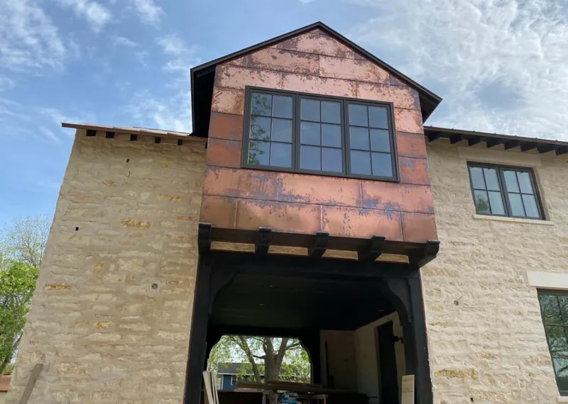 Copper metal panel facade on a stone building for Skylight Installation in Union City
