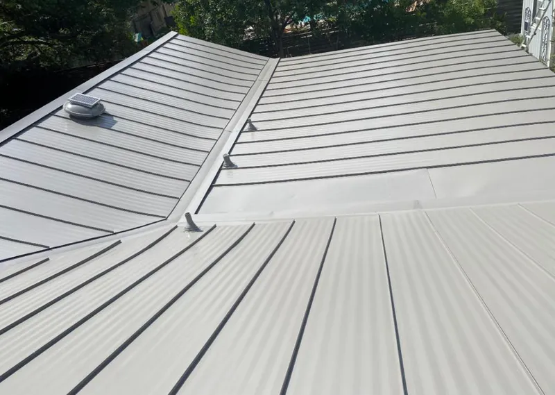Solar attic fan installed on a metal roof for Roof Ventilation in Union City
